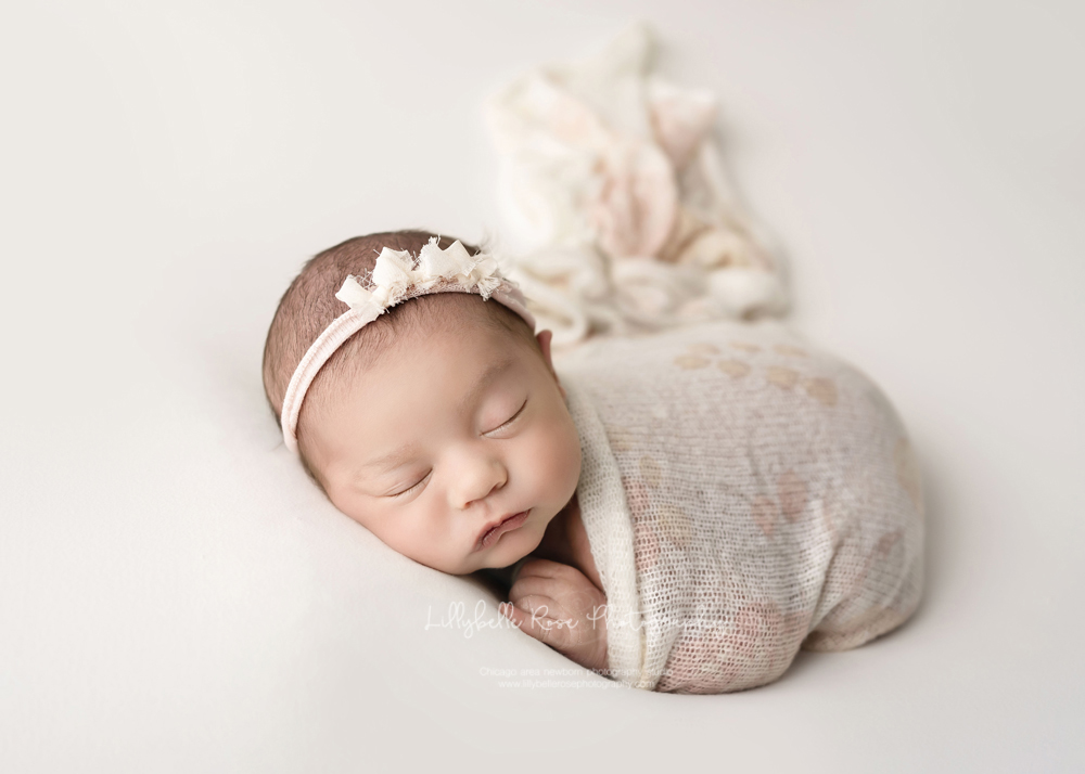 beautiful baby girl with rose swaddle