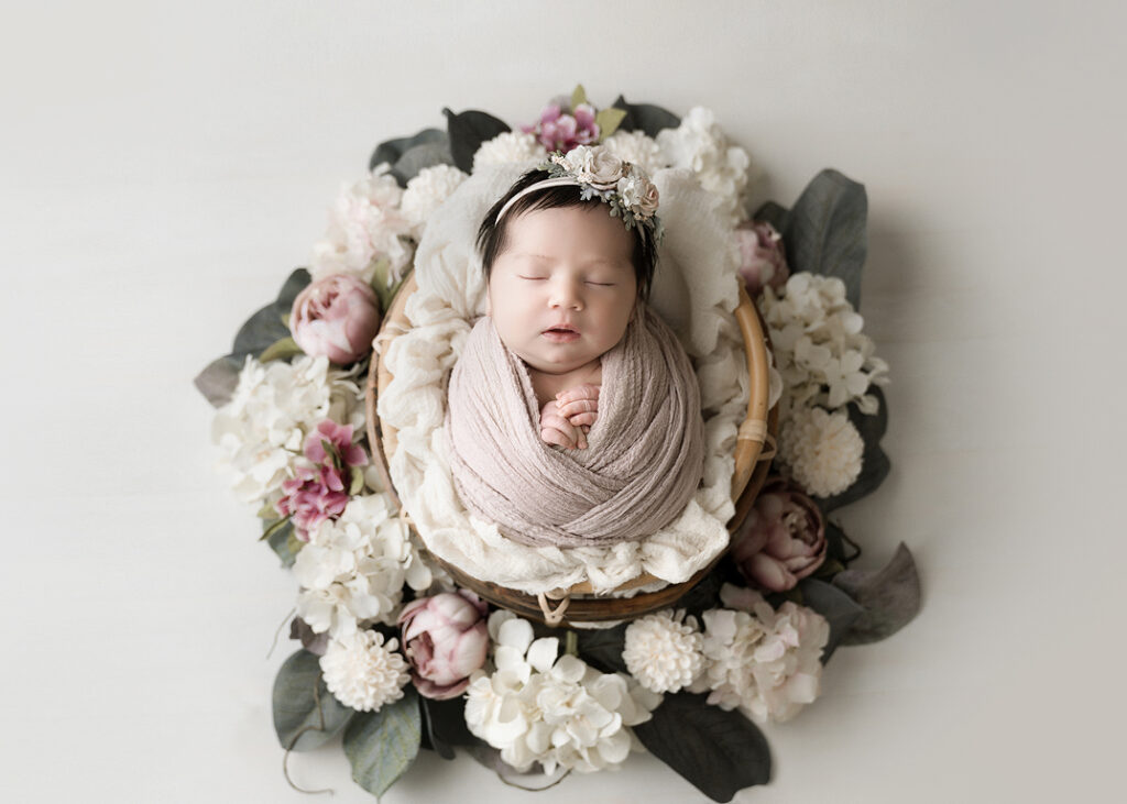 newborn photography near me, baby girl in floral basket