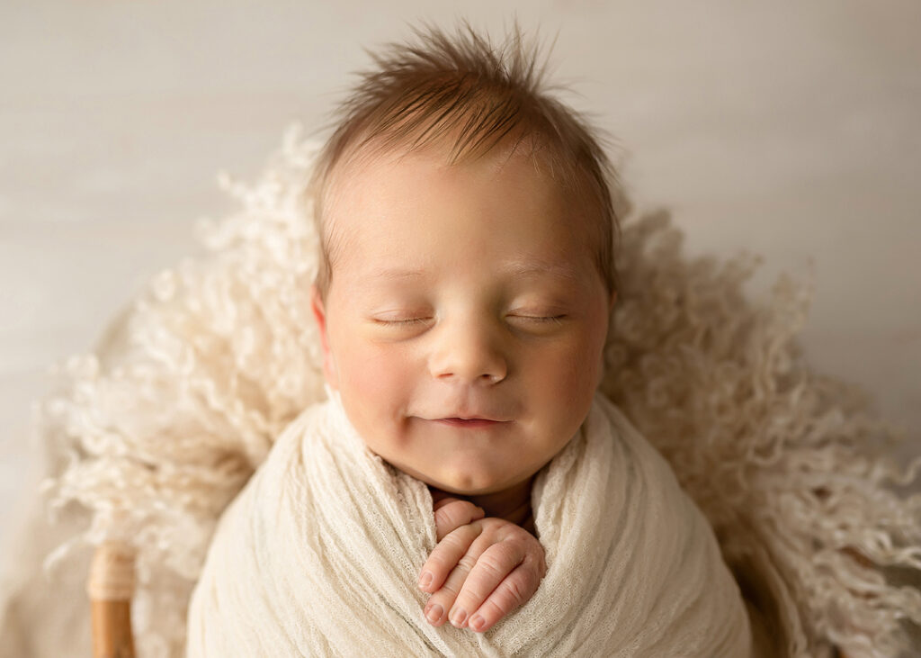Naperville Newborn Pictures of baby boy in cream