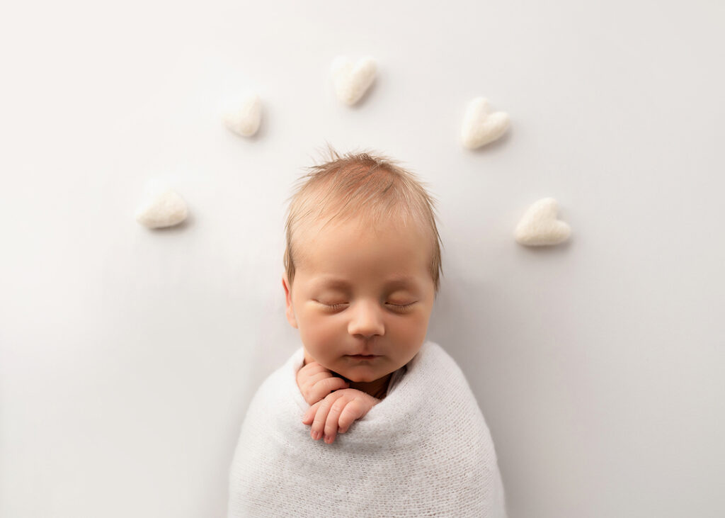 Naperville Newborn Pictures of beautiful baby boy sleeping with hearts