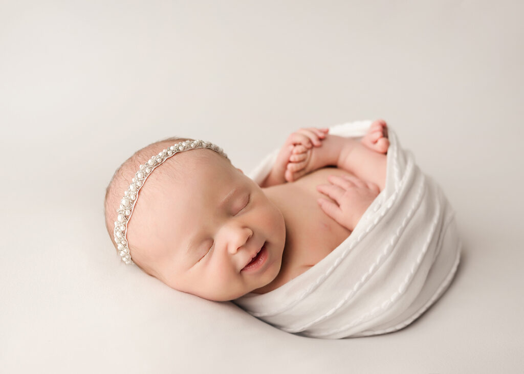 chicago newborn photoshoot with smiling baby