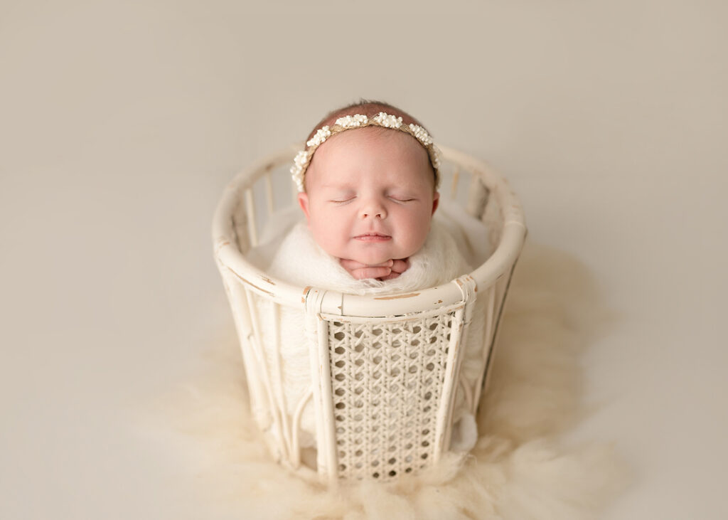 swaddled baby girl in cute pose
